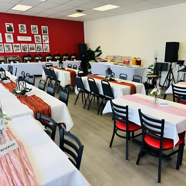 A Filipino Bakery Cafe & Market dining room with tables set for an event, featuring a buffet line.