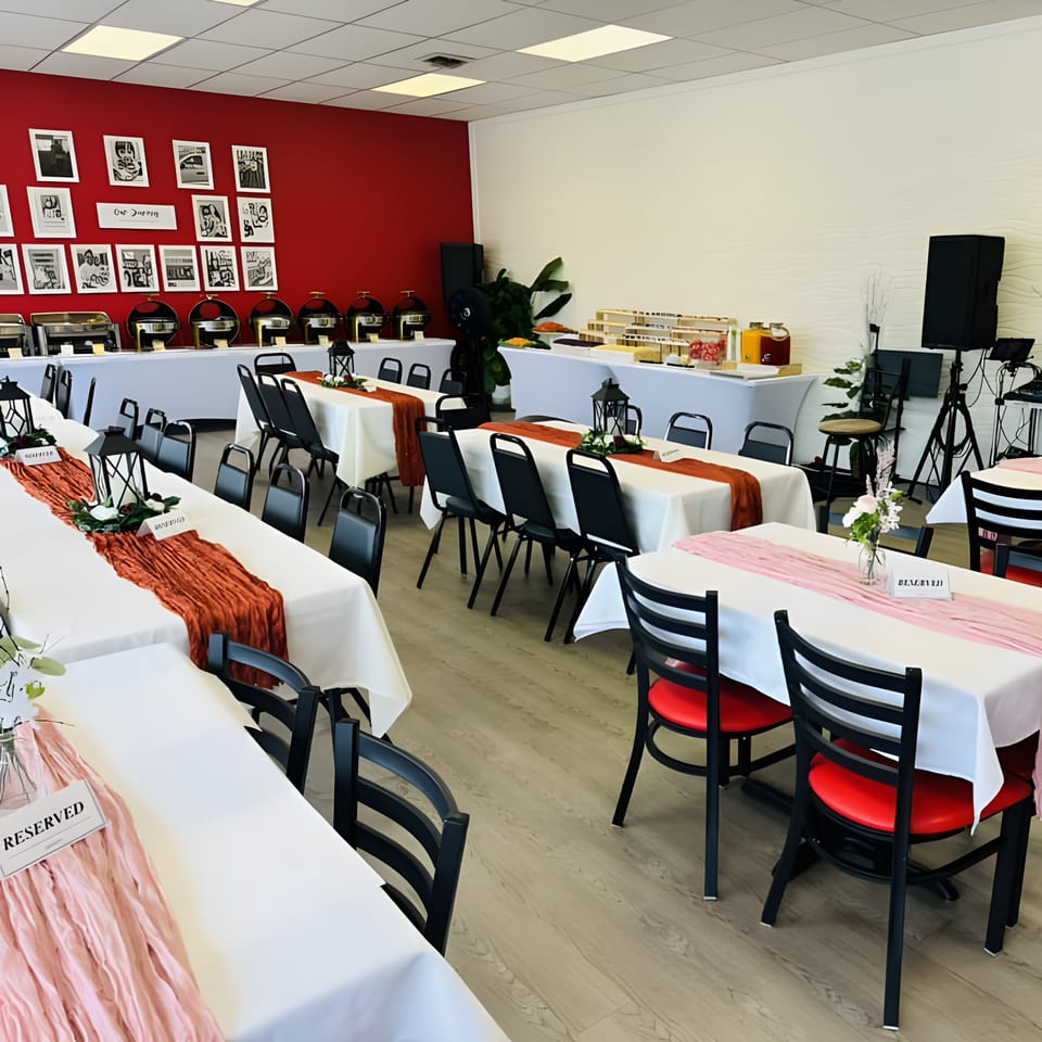 A Filipino Bakery Cafe & Market dining room with tables set for an event, featuring a buffet line.